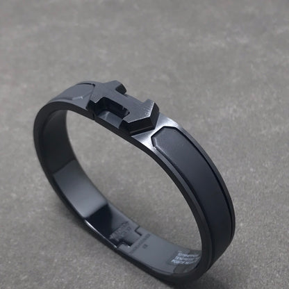 🖤 Timeless Boldness: Hermès Black “H” Clic Clac Bracelet (Silver & Matte Black)
